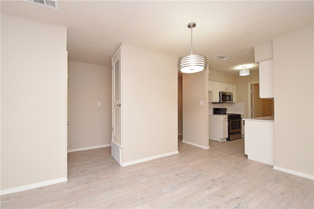 6400 Brookside Drive, Unit B Austin, TX 78723 - Photo 18 of 25 a view of a kitchen with refrigerator and cabinets