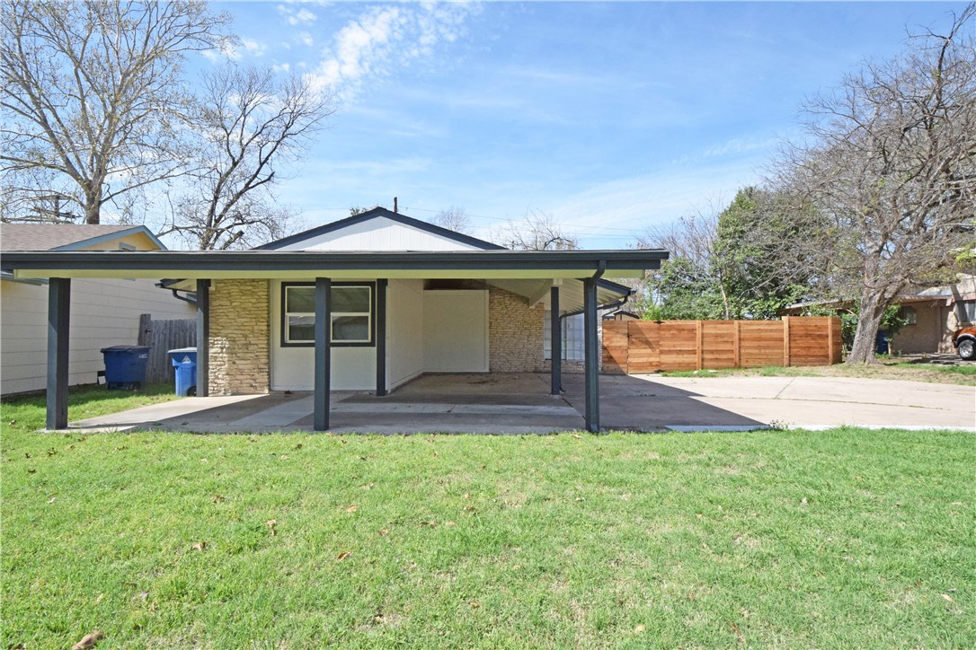 6400 Brookside Drive, Unit B Austin, TX 78723 - Photo 2 of 25 a front view of a house with a yard and trees