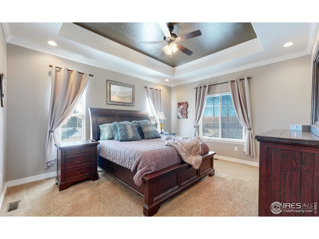 3201 Timeless Circle Berthoud, CO 80513 - Photo 17 of 39 Large main level primary bedroom with high ceilings and tons of natural light with views of the west