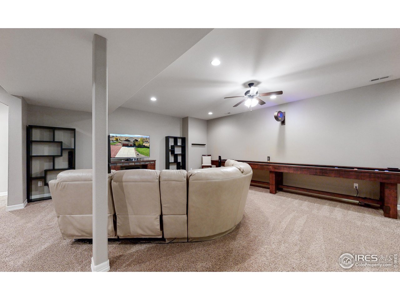 3201 Timeless Circle Berthoud, CO 80513 - Photo 21 of 39 Basement living with custom shuffle board