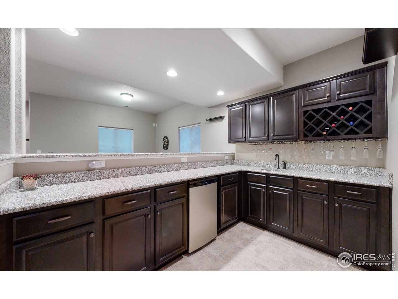 3201 Timeless Circle Berthoud, CO 80513 - Photo 24 of 39 Great size built in wet bar in the basement with mini fridge and tons of storage