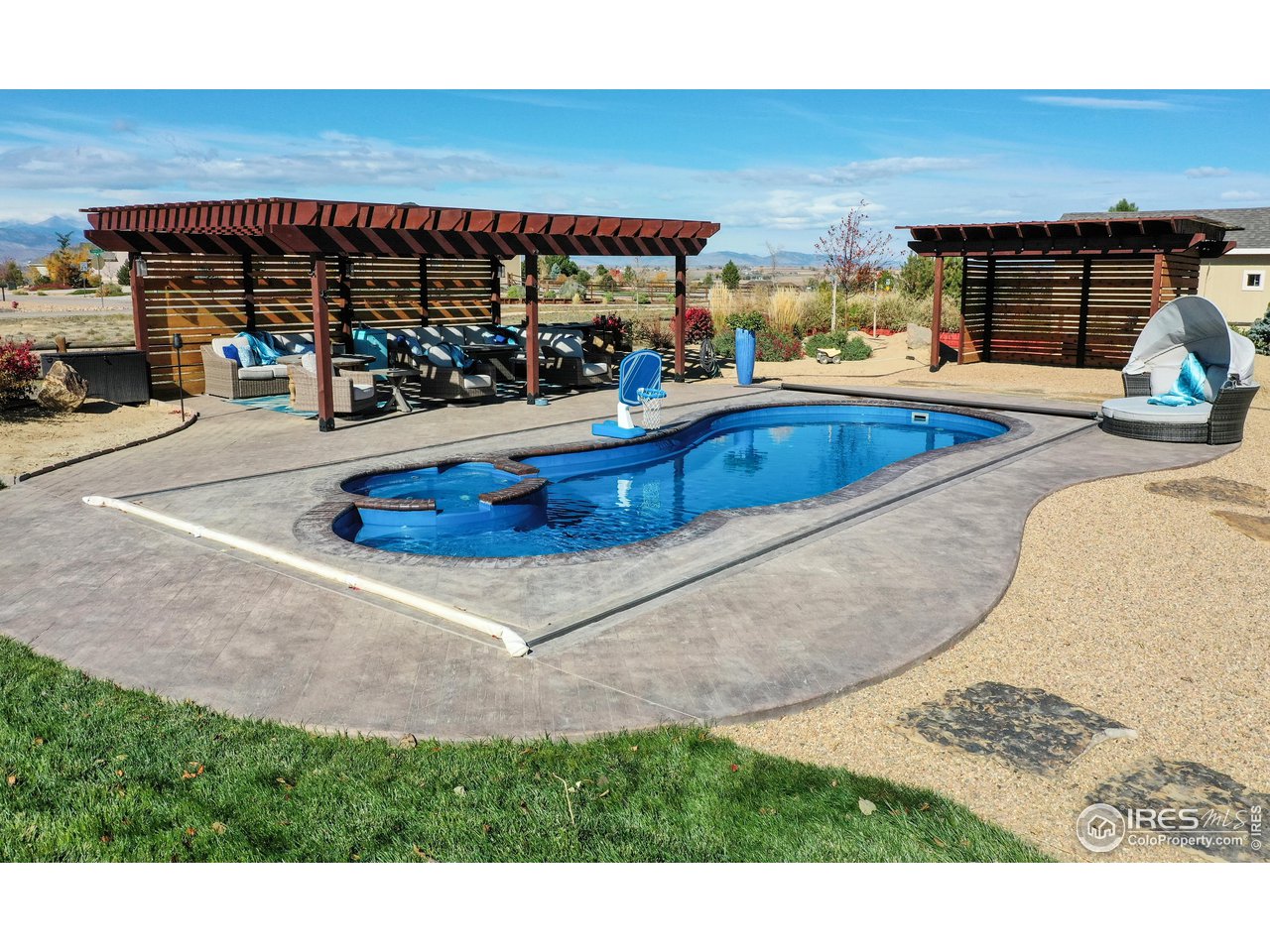3201 Timeless Circle Berthoud, CO 80513 - Photo 35 of 39 Saltwater pool with stamped concrete surround