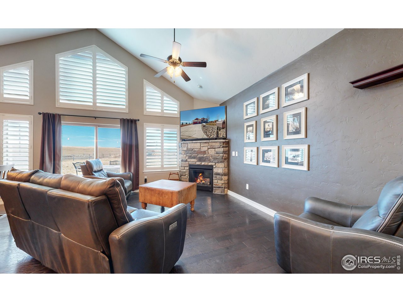 3201 Timeless Circle Berthoud, CO 80513 - Photo 6 of 39 Main level living with gas stone fireplace