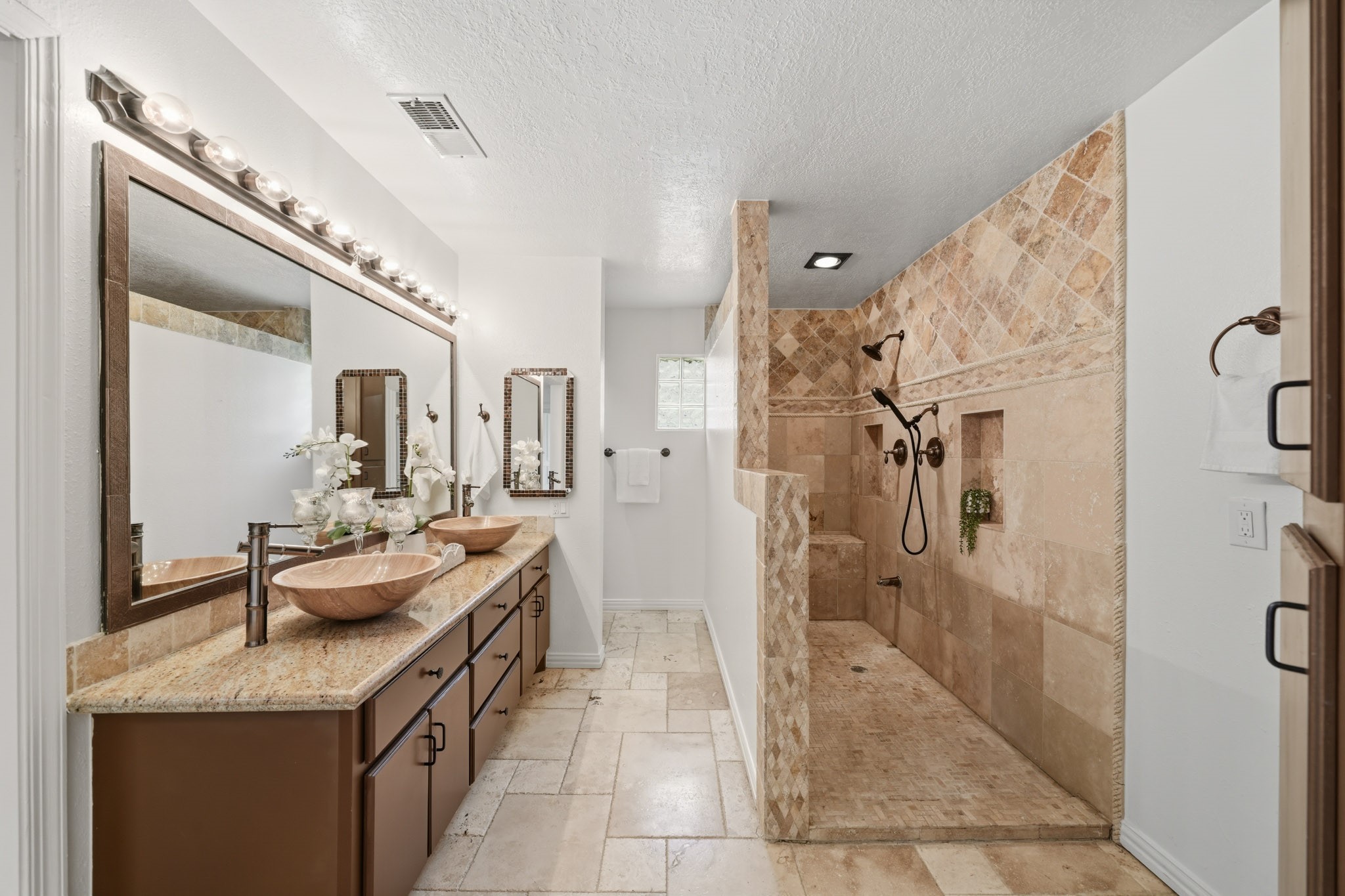 79 Summers Wind Street Conroe, TX 77356 - Photo 23 of 45 a spacious bathroom with a granite countertop sink mirror and shower