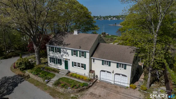 an aerial view of a house with a yard