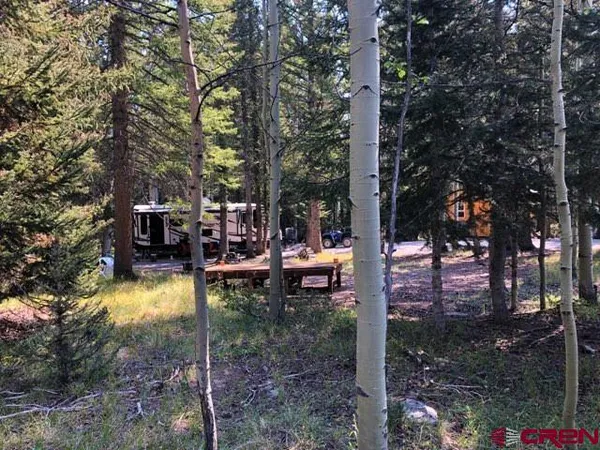 a swimming pool with outdoor seating and yard