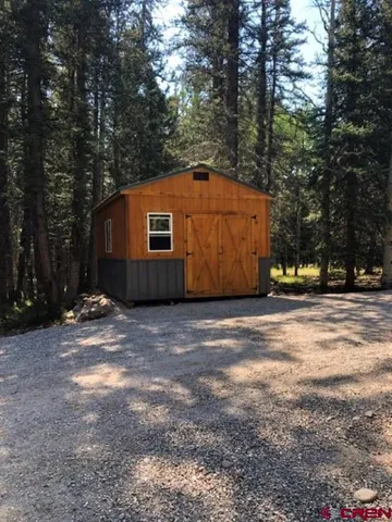 a house with trees in front of it