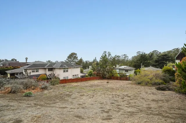 a view of a road with a building in the background