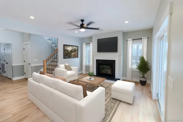 a view of living room kitchen island furniture and fireplace