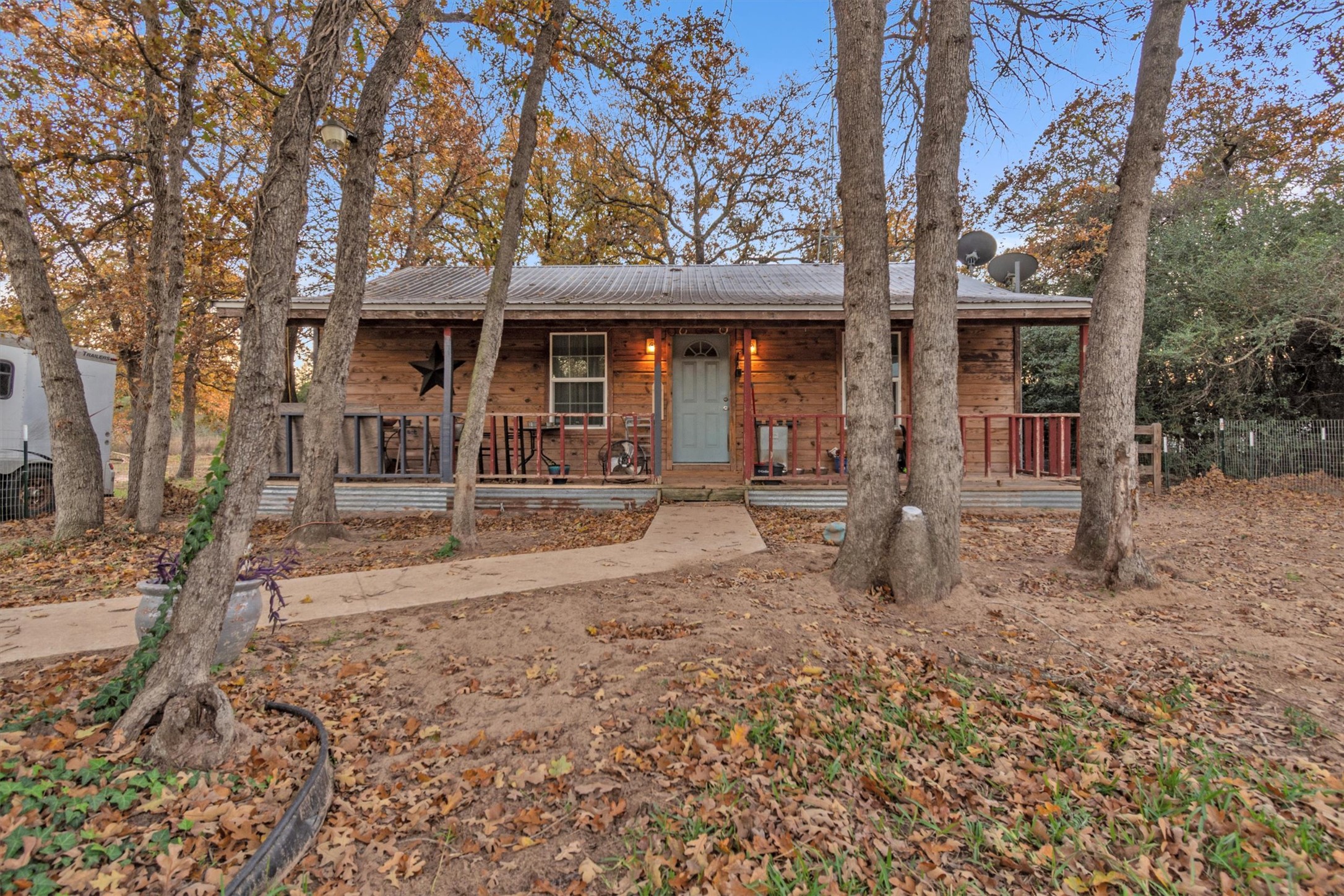 View of front of home featuring a porch and a metal roof