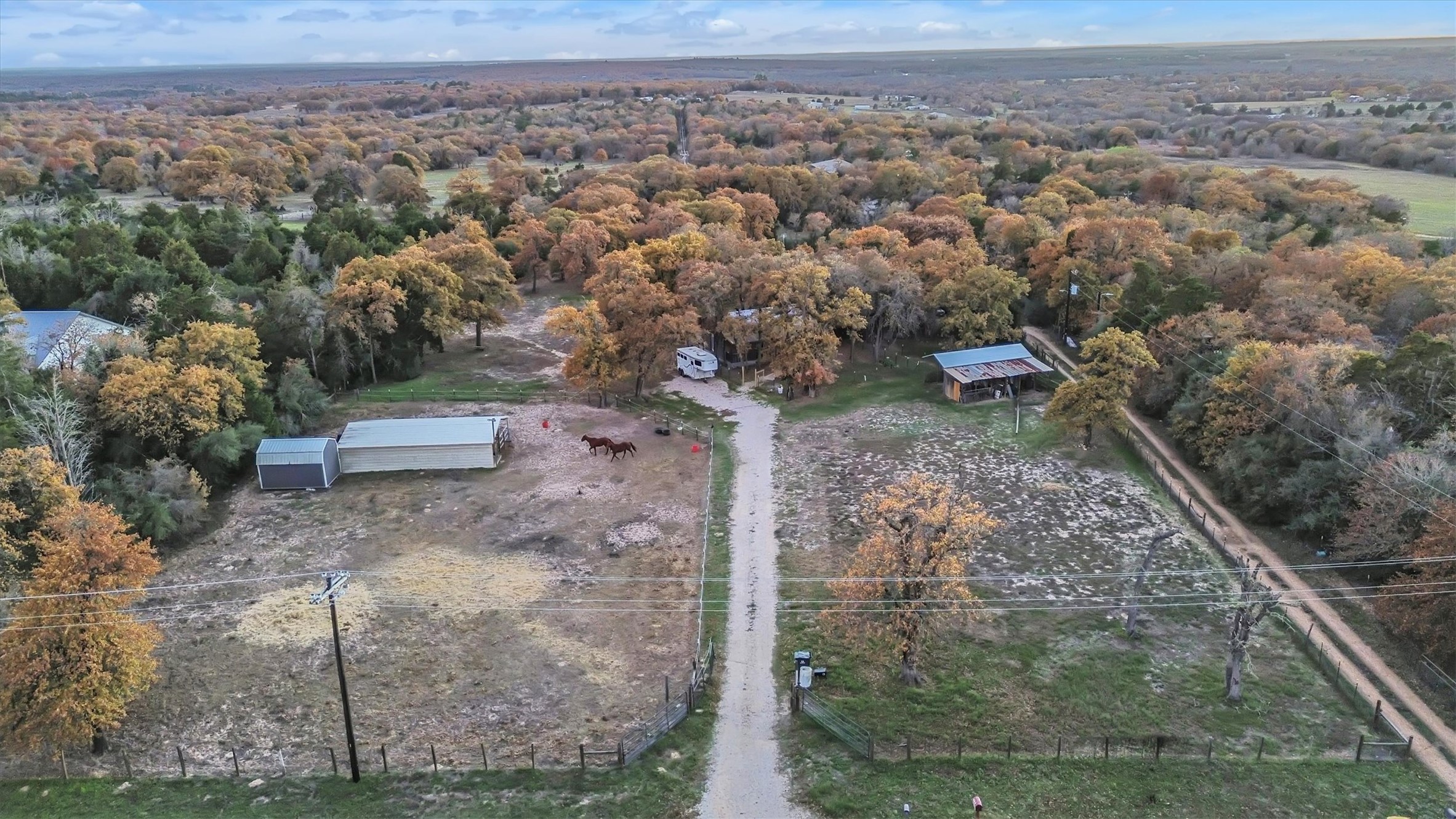 149 Wayside Drive Elgin, TX 78621 - Photo 20 of 24 Aerial view of property and surrounding area with a heavily wooded area