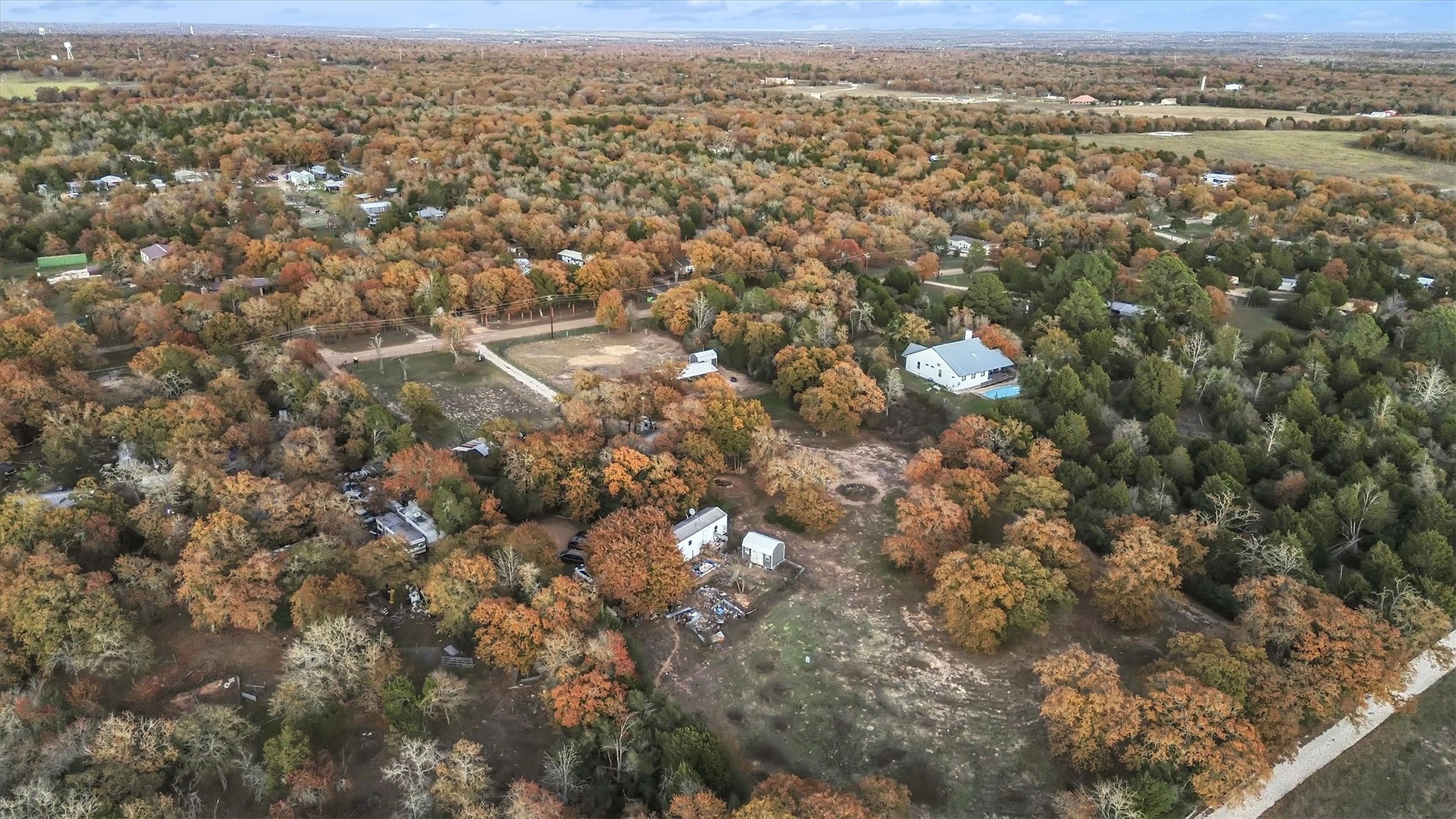 149 Wayside Drive Elgin, TX 78621 - Photo 21 of 24 Aerial view of property and surrounding area featuring a forest