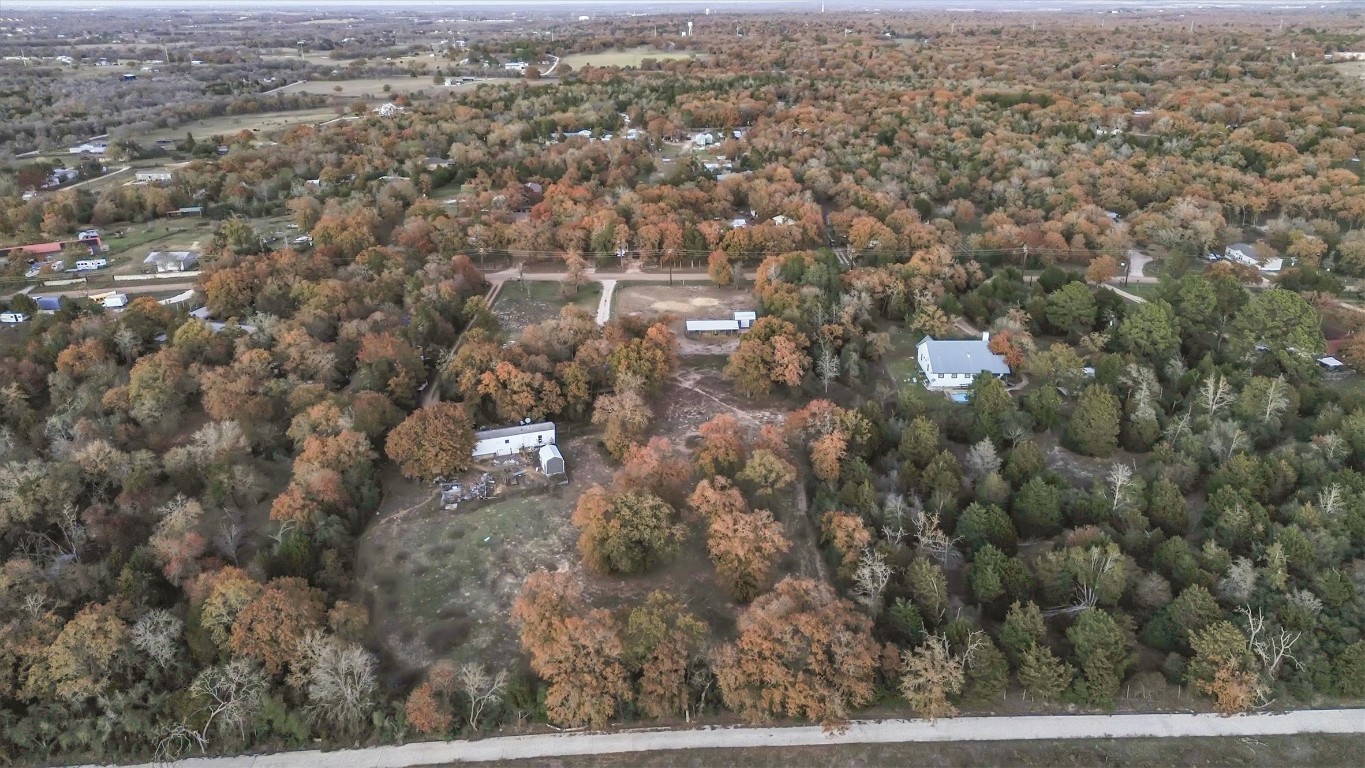 146 Wayside Drive Elgin, TX 78621 - Photo 22 of 24 Aerial overview of property's location with a forest