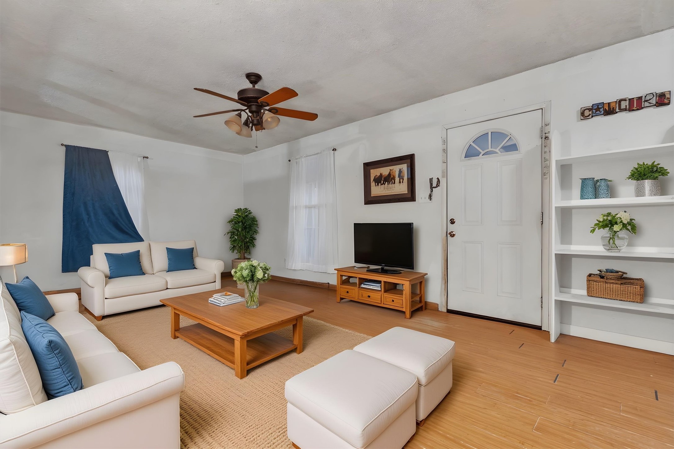 149 Wayside Drive Elgin, TX 78621 - Photo 3 of 24 Living area featuring wood finished floors and a ceiling fan