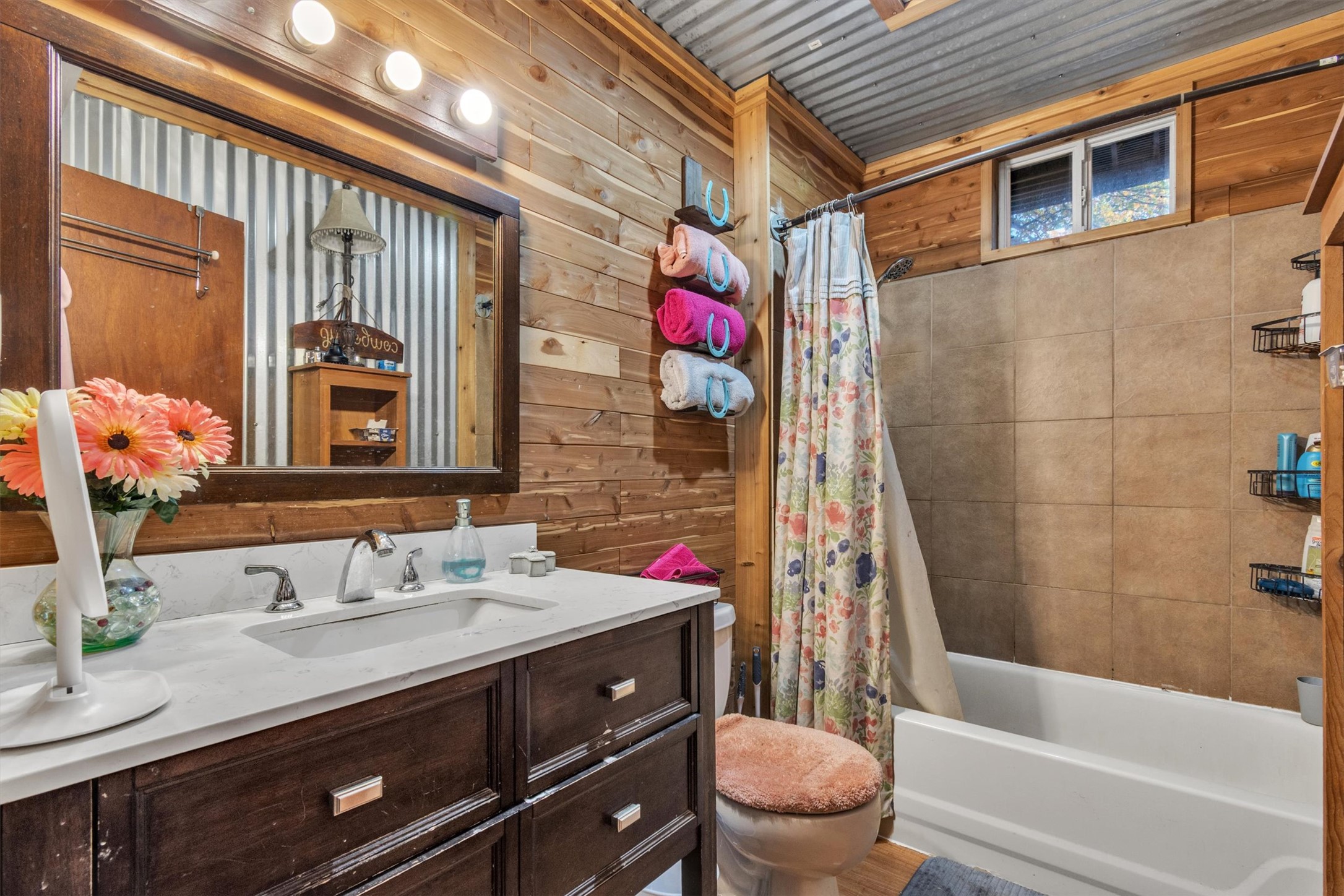 149 Wayside Drive Elgin, TX 78621 - Photo 10 of 24 Full bath featuring vanity, wood walls, and shower / tub combo