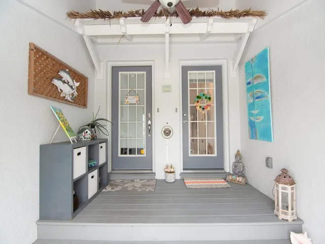a view of an entryway with wooden floor