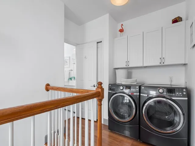 a utility room with sink washer and dryer