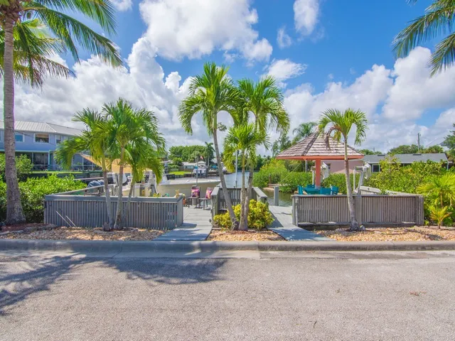 a view of a chairs and tables in the balcony