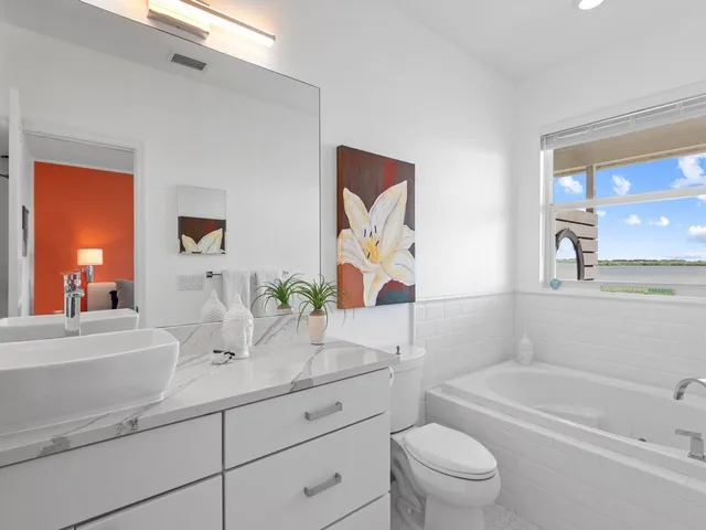 a bathroom with a sink a toilet and a bathtub