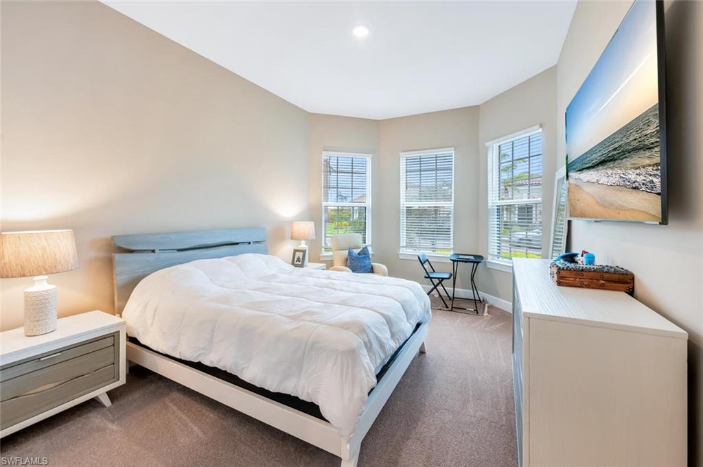8448 Rosa Court Naples, FL 34114 - Photo 18 of 24 Neutral-toned walls and plush carpeting define this space