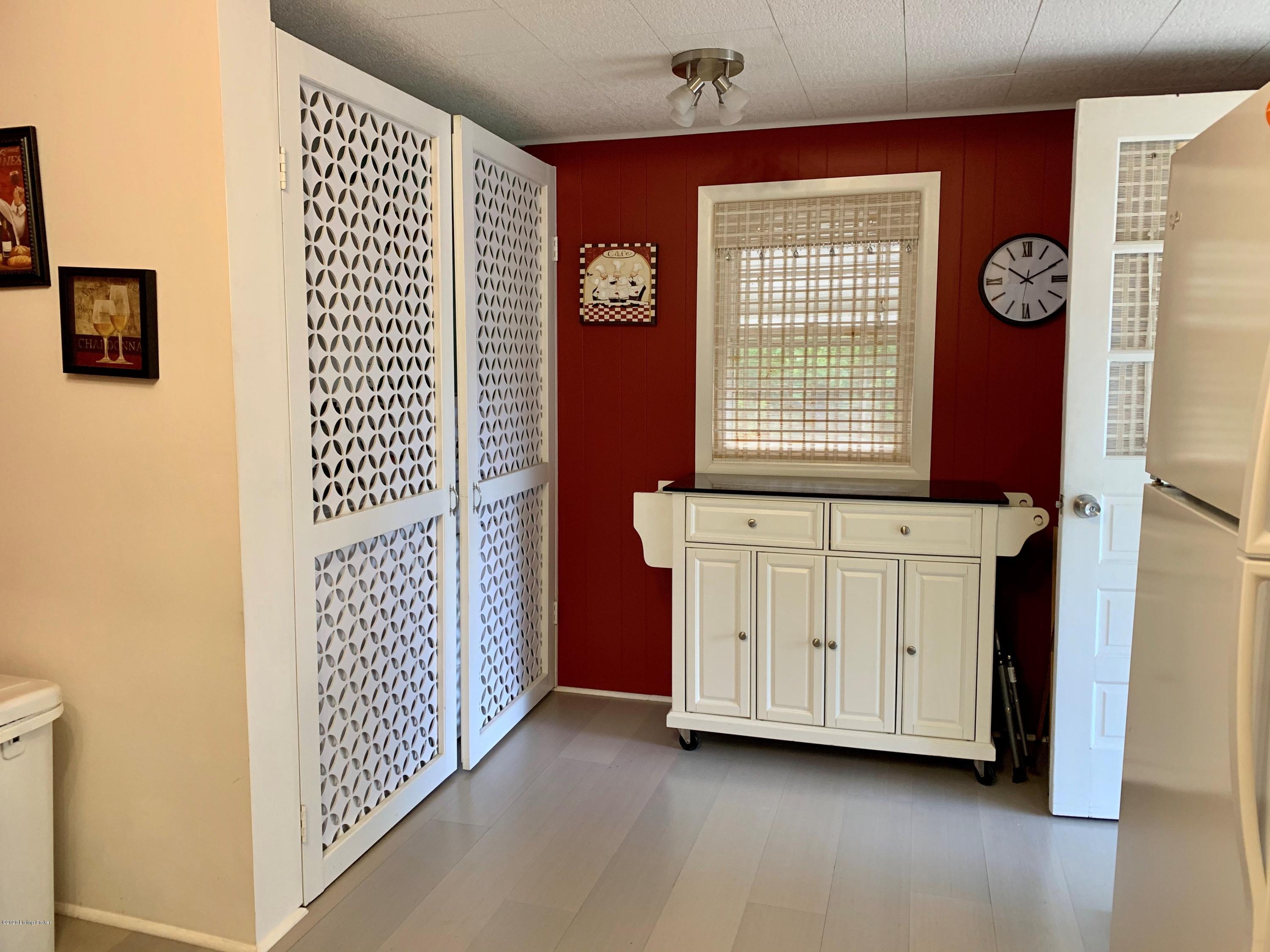 718 Shaffer Road Fairdale, KY 40118 - Photo 9 of 21 Back door entry and double door where laundry is located