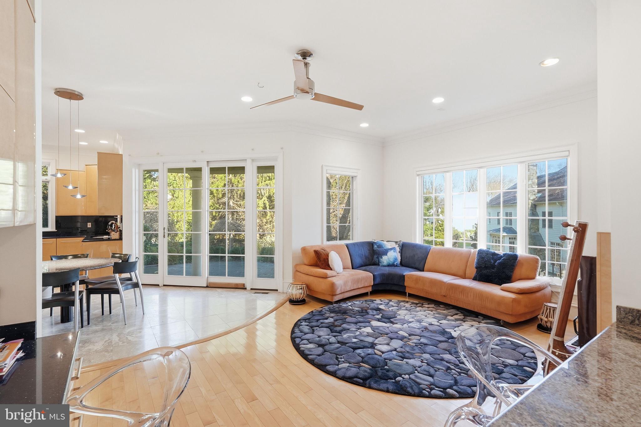 8537 Rapley Preserve Circle Potomac, MD 20854 - Photo 11 of 40 a living room with furniture large windows and wooden floor