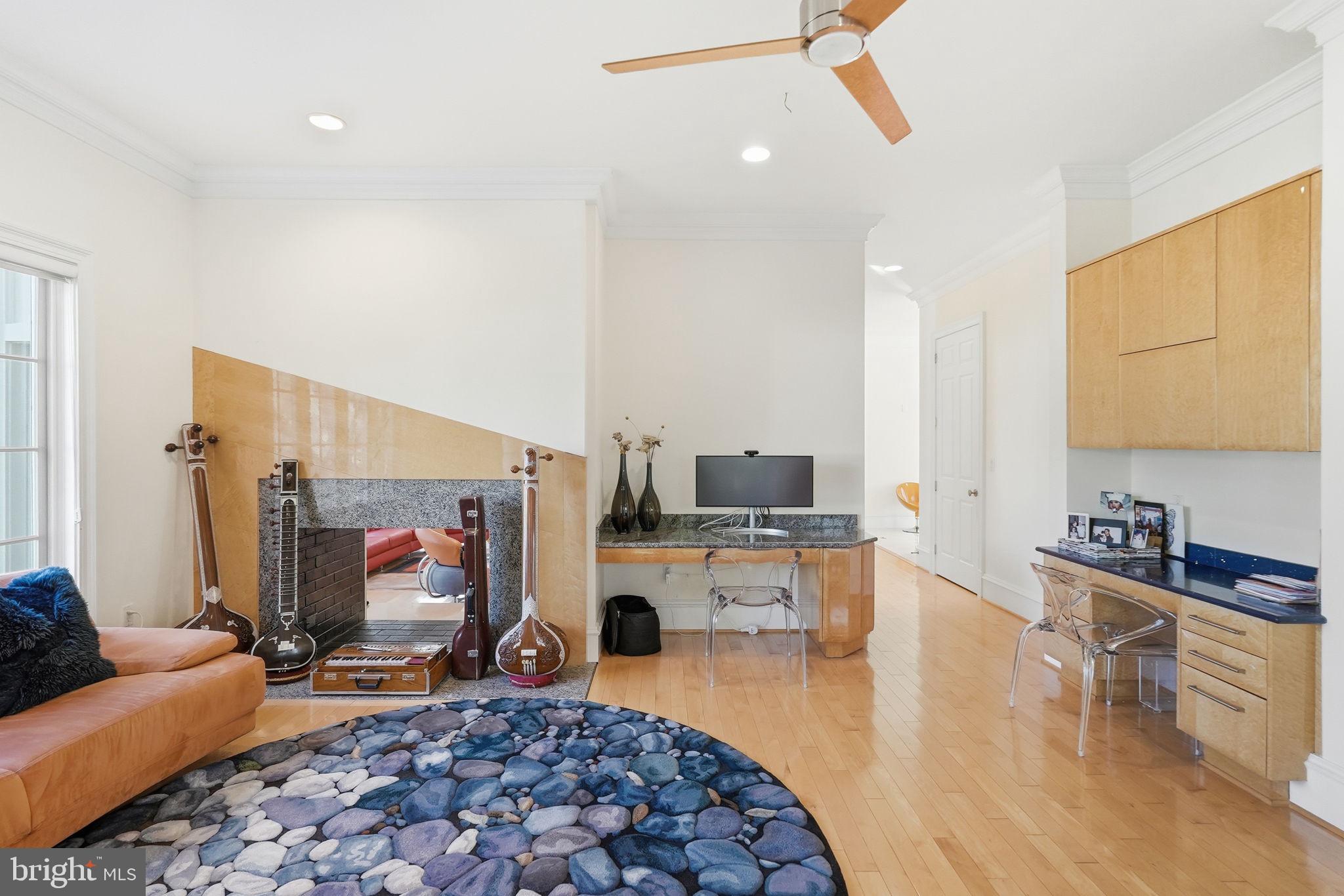 8537 Rapley Preserve Circle Potomac, MD 20854 - Photo 12 of 40 a living room with furniture and a flat screen tv