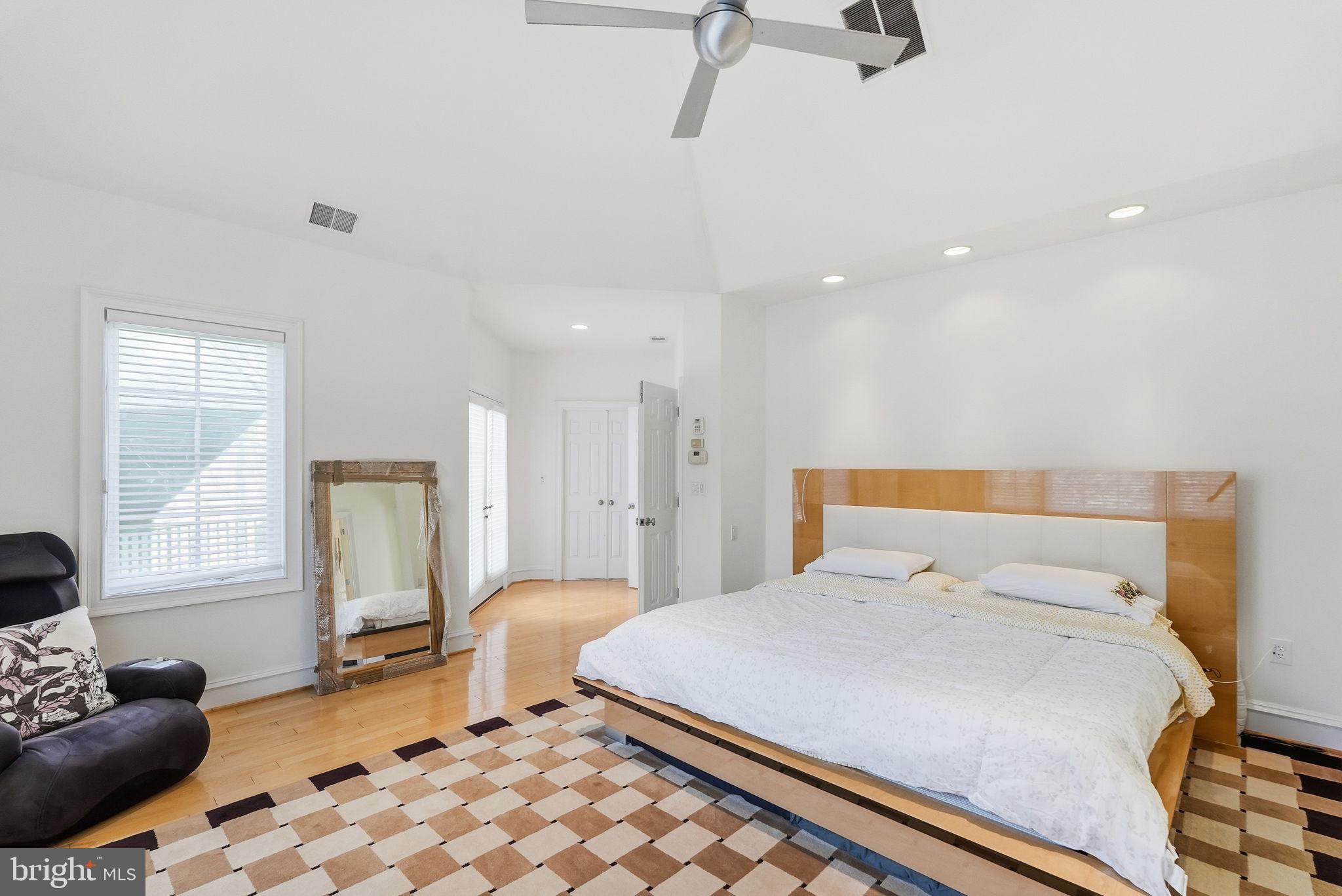 8537 Rapley Preserve Circle Potomac, MD 20854 - Photo 15 of 40 a bedroom with a large bed and window