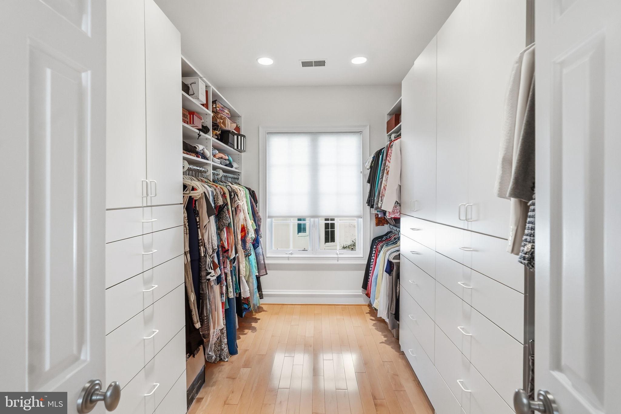 8537 Rapley Preserve Circle Potomac, MD 20854 - Photo 17 of 40 a view of walk in closet with clothes and shoes