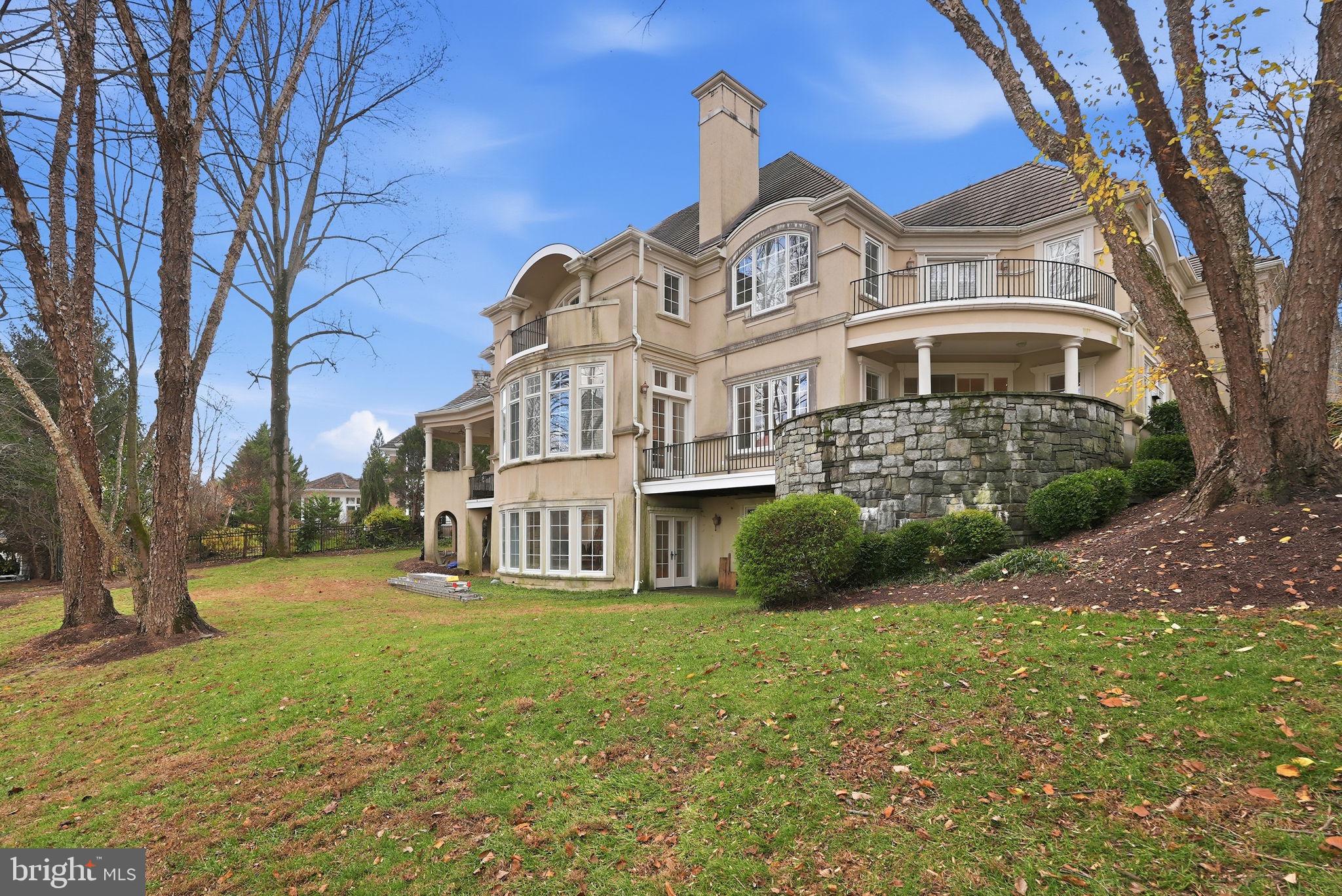 8537 Rapley Preserve Circle Potomac, MD 20854 - Photo 2 of 40 a view of a big house with a big yard and large trees