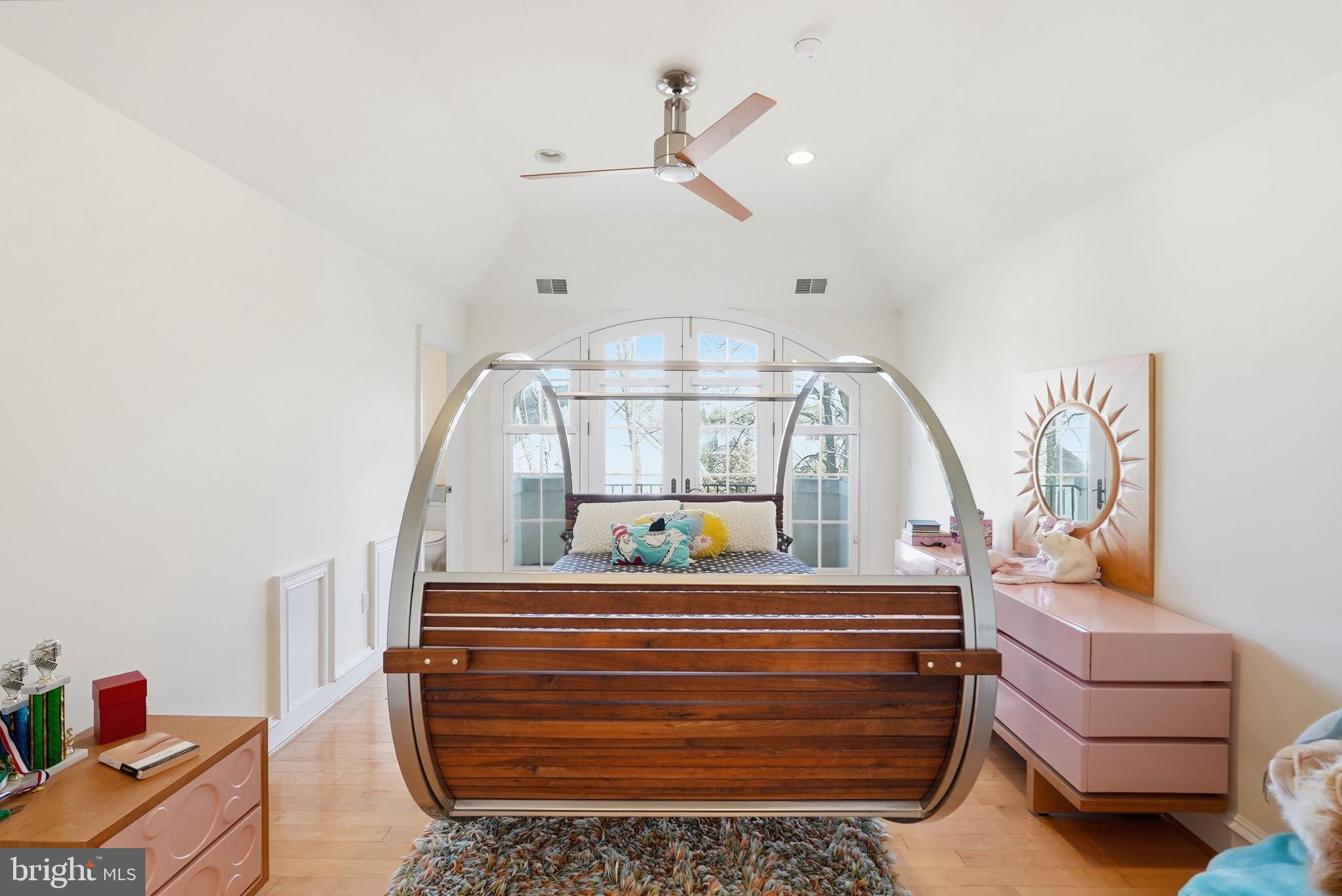8537 Rapley Preserve Circle Potomac, MD 20854 - Photo 24 of 40 a bedroom with a bed and a chandelier