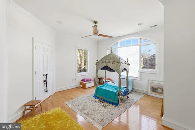 a bathroom with a granite countertop sink a toilet and a mirror