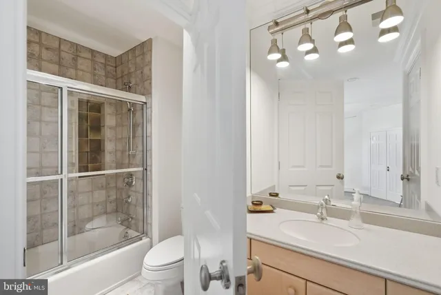 a view of cabinets a washer and dryer