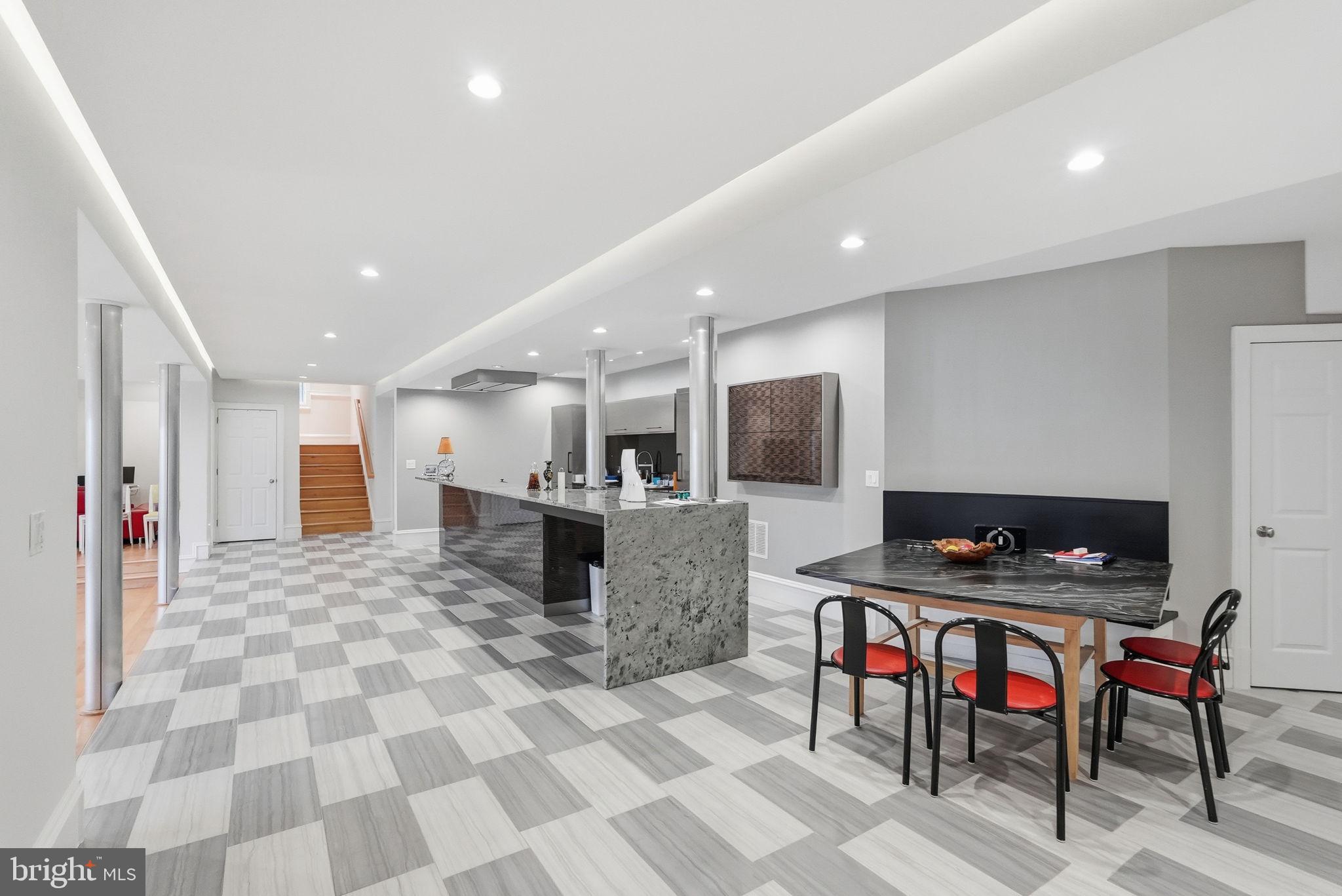8537 Rapley Preserve Circle Potomac, MD 20854 - Photo 34 of 40 a large kitchen with a table and chairs in it