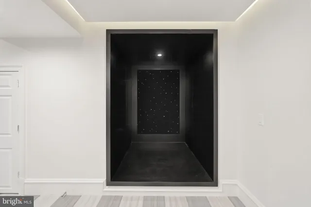 a media room with lots of chairs and a projector screen