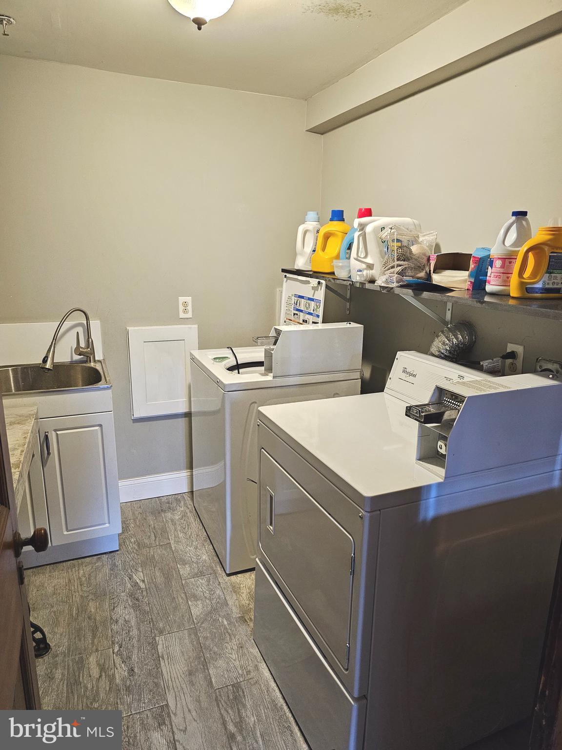 1268 South 26th Street, Unit 3E Philadelphia, PA 19146 - Photo 11 of 13 a utility room with dryer and washer