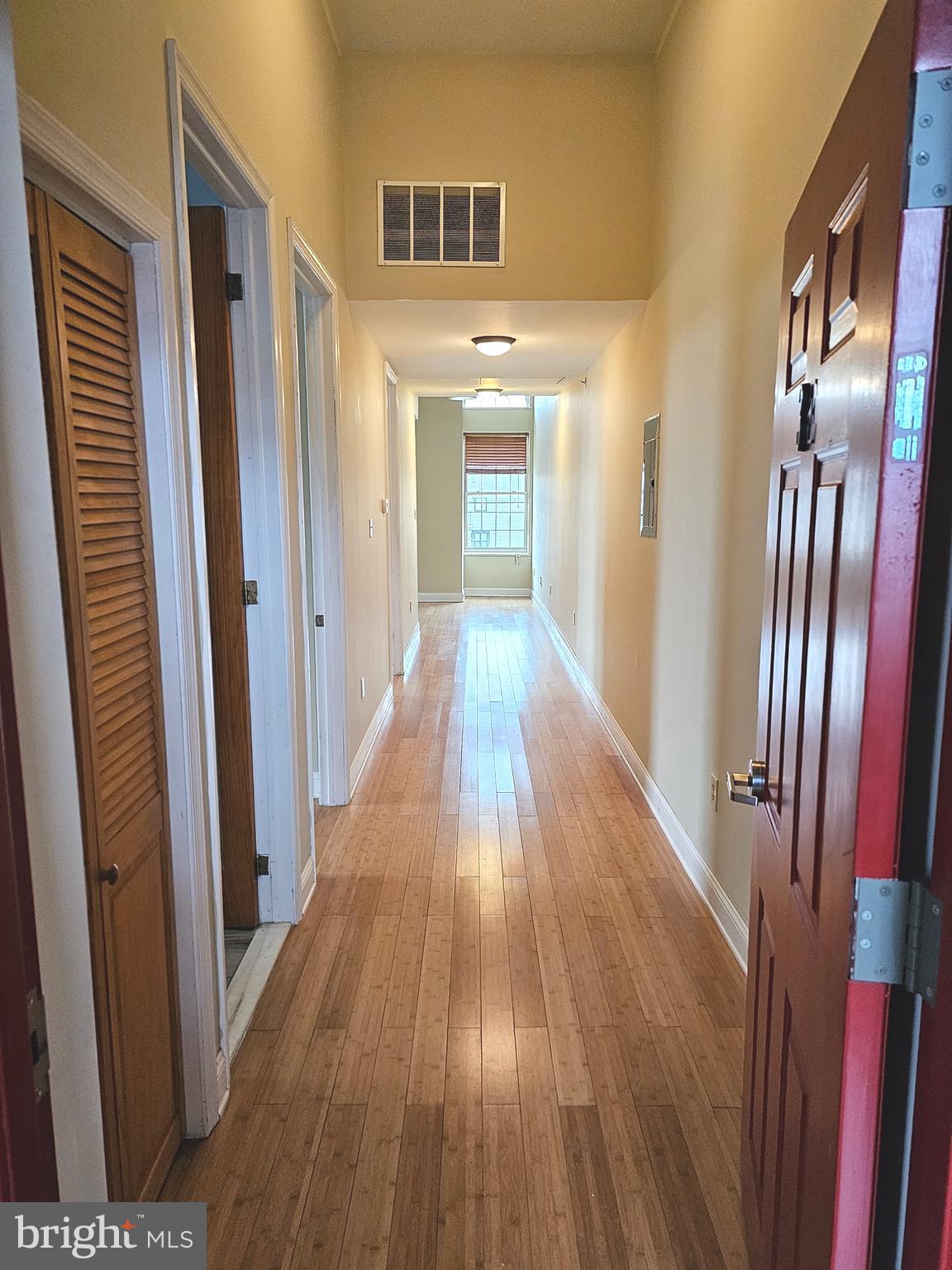 1268 South 26th Street, Unit 3E Philadelphia, PA 19146 - Photo 3 of 13 a view of a hallway with wooden floor