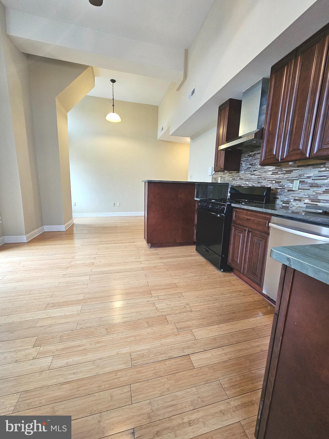 1268 South 26th Street, Unit 3E Philadelphia, PA 19146 - Photo 4 of 13 a bedroom with a bed and cabinets