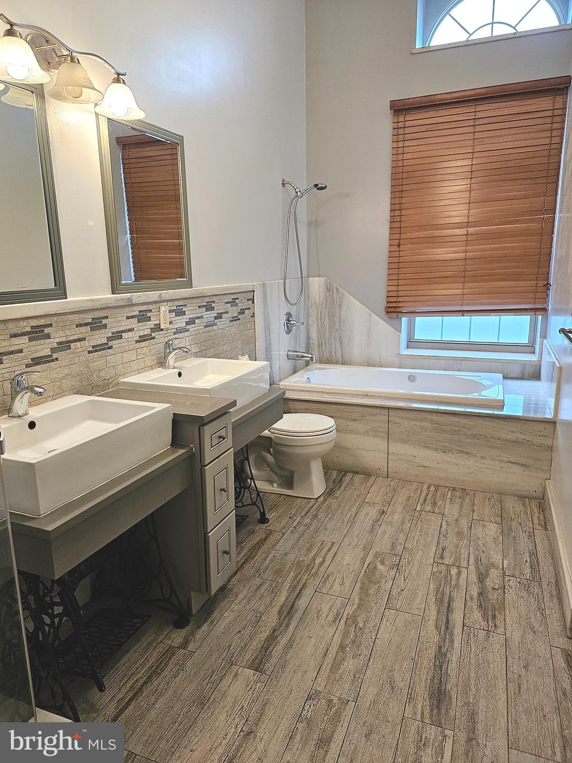 1268 South 26th Street, Unit 3E Philadelphia, PA 19146 - Photo 7 of 13 a bathroom with a sink and a mirror