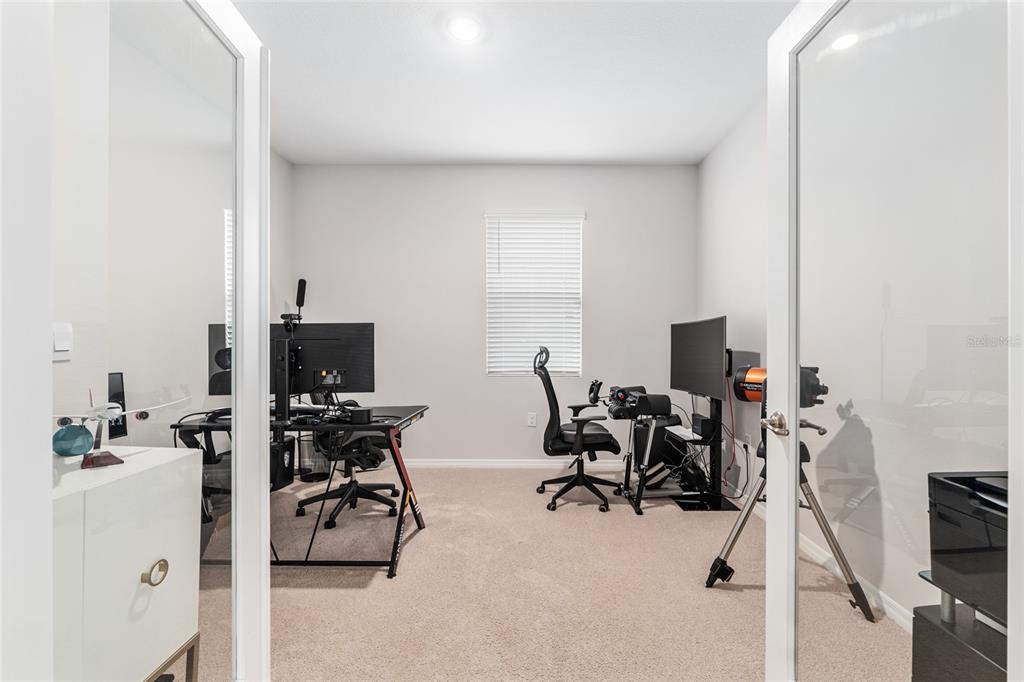6243 Southwest 89th St Road Ocala, FL 34476 - Photo 11 of 57 a view of a livingroom with workspace and a window