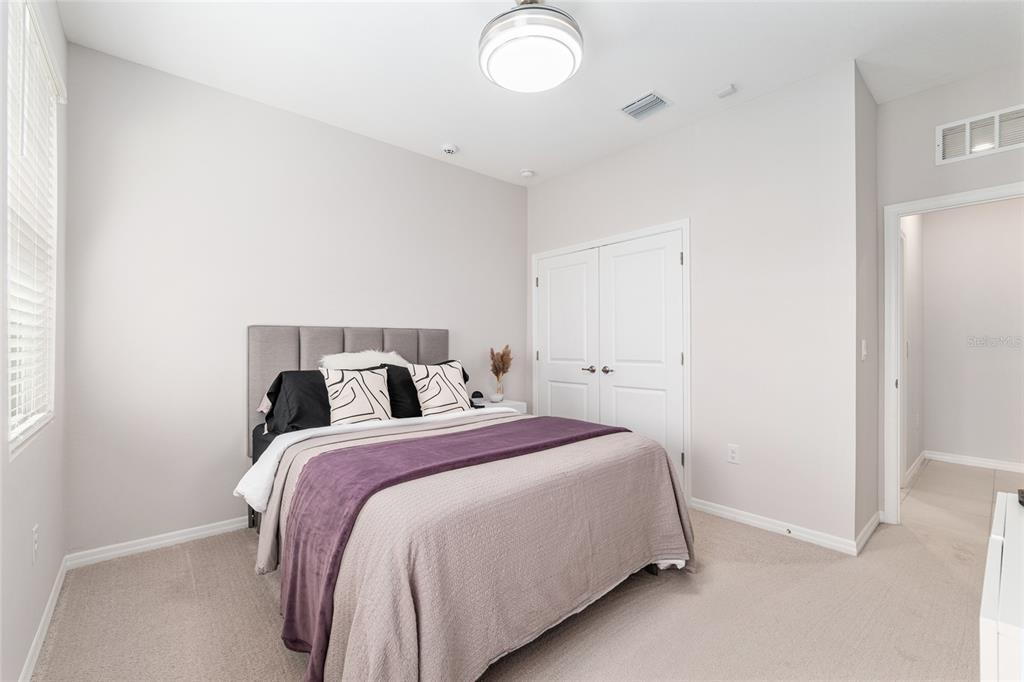 6243 Southwest 89th St Road Ocala, FL 34476 - Photo 14 of 57 a bedroom with a bed and a window