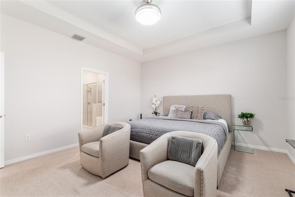 6243 Southwest 89th St Road Ocala, FL 34476 - Photo 25 of 57 a bedroom with a bed and a couch