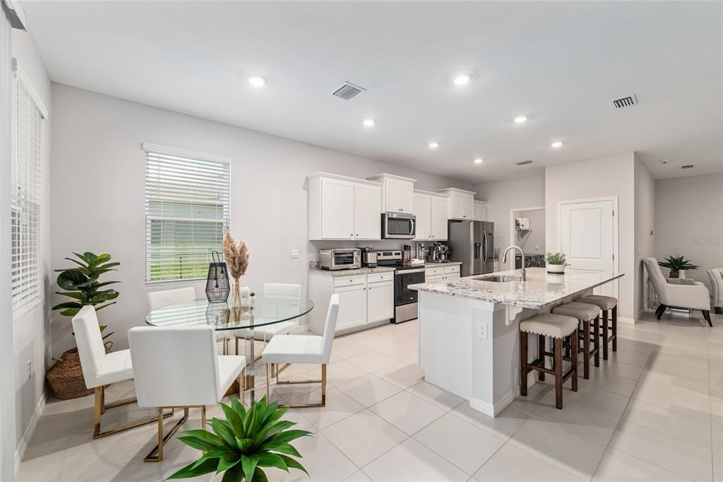 6243 Southwest 89th St Road Ocala, FL 34476 - Photo 35 of 57 a kitchen with white cabinets and white appliances