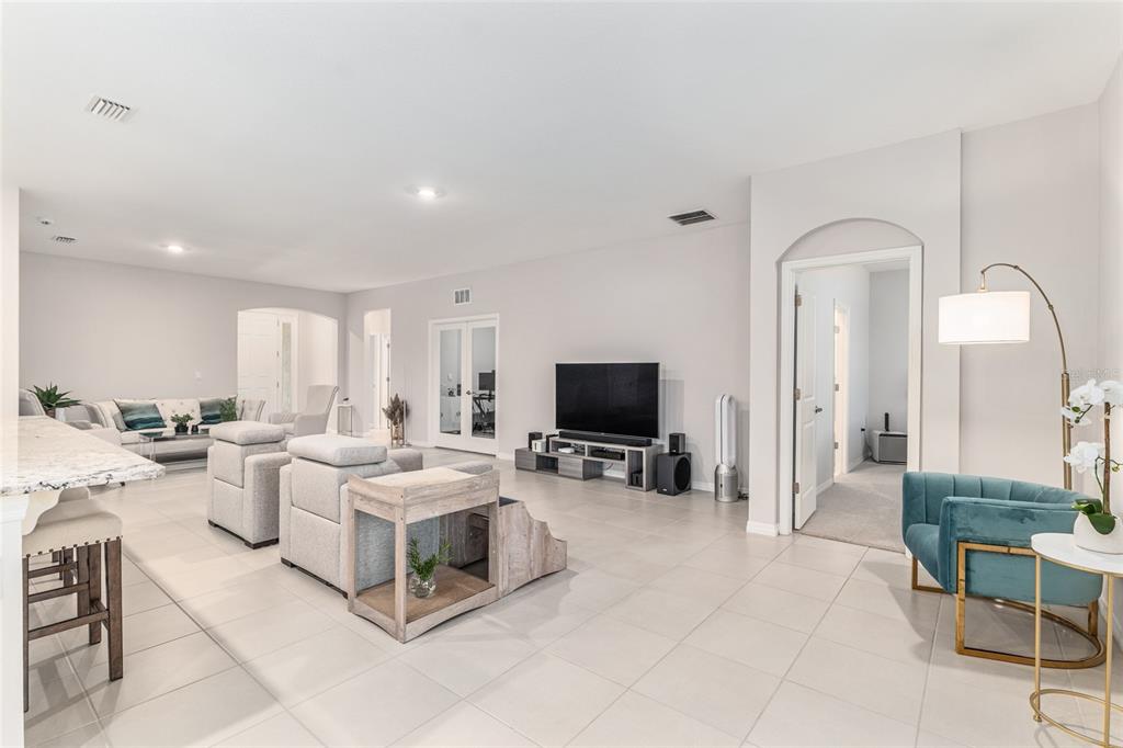6243 Southwest 89th St Road Ocala, FL 34476 - Photo 37 of 57 a living room with furniture and a flat screen tv