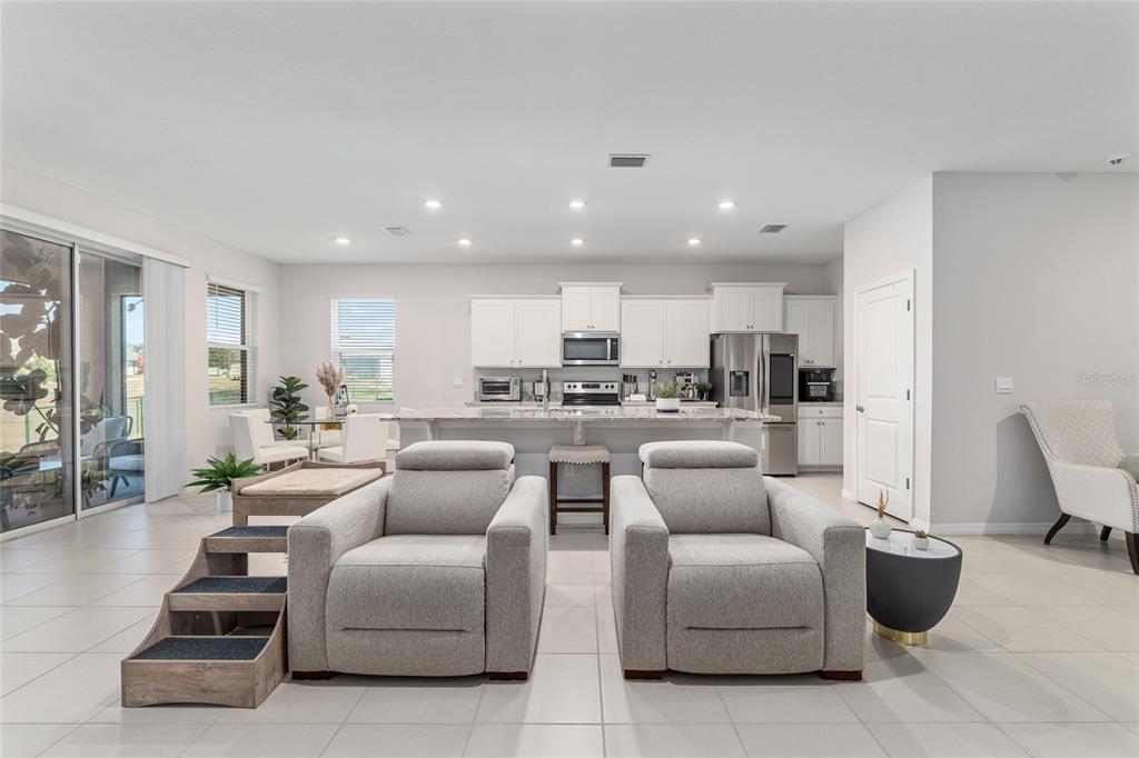 6243 Southwest 89th St Road Ocala, FL 34476 - Photo 40 of 57 a living room with furniture and view of kitchen