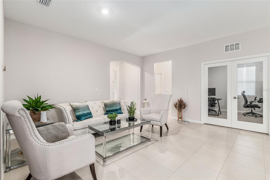 6243 Southwest 89th St Road Ocala, FL 34476 - Photo 41 of 57 a living room with furniture and white walls