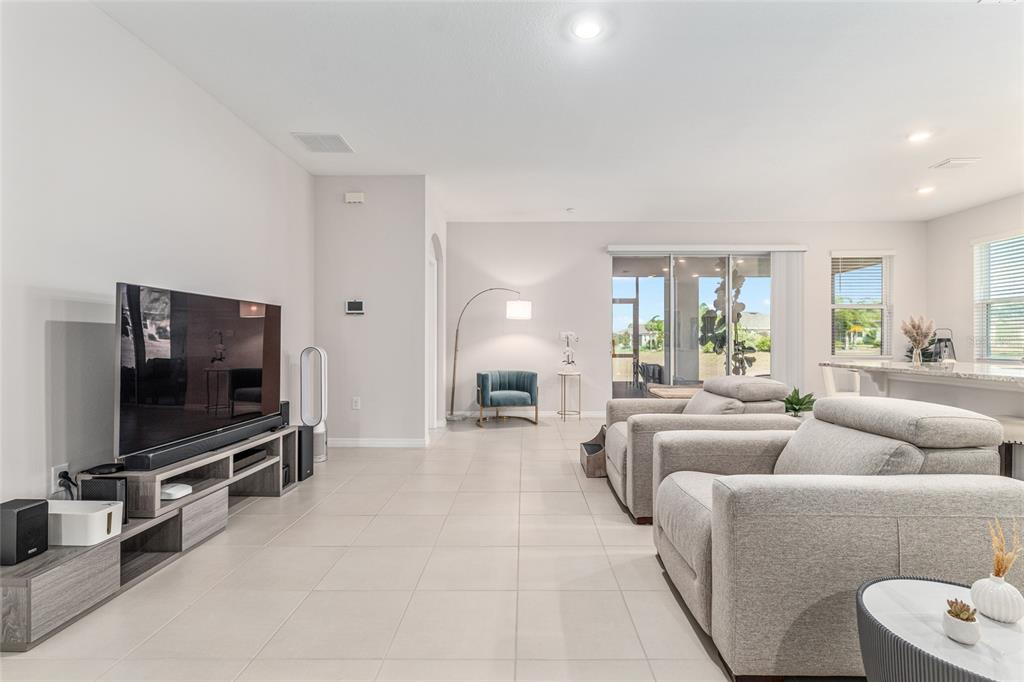 6243 Southwest 89th St Road Ocala, FL 34476 - Photo 42 of 57 a living room with furniture and a flat screen tv