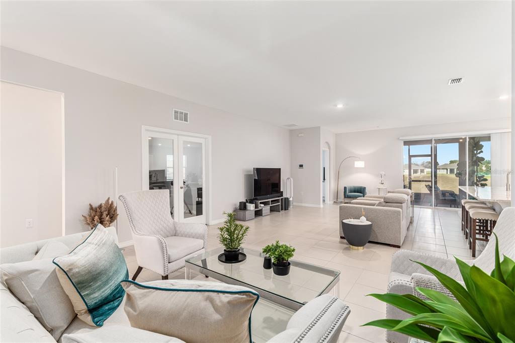 6243 Southwest 89th St Road Ocala, FL 34476 - Photo 44 of 57 a living room with furniture and a flat screen tv