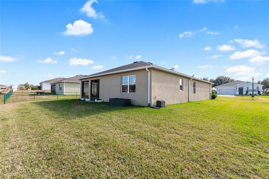 6243 Southwest 89th St Road Ocala, FL 34476 - Photo 50 of 57 a view of a house with backyard and garden