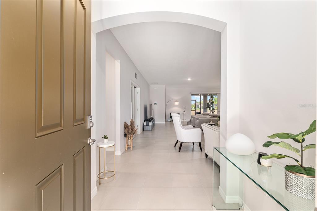 6243 Southwest 89th St Road Ocala, FL 34476 - Photo 7 of 57 a living room with furniture and a potted plant